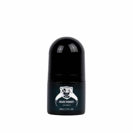 En svart cylindrisk deodorant med silvriga detaljer märkt "Beard Monkey Licorice" med en apa som logotyp.