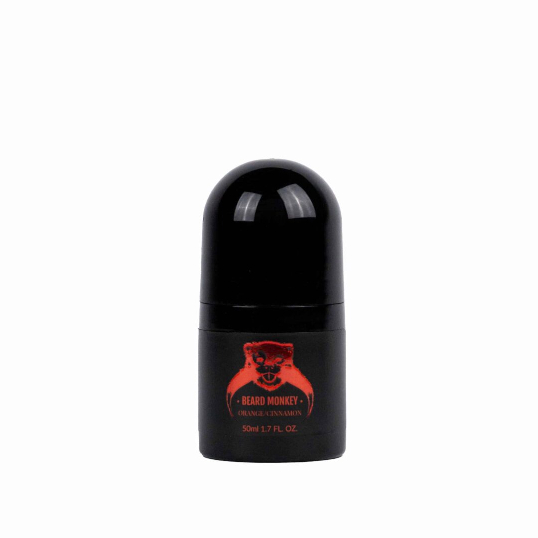 En svart cylindrisk deodorant med röda detaljer märkt "Beard Monkey Orange/Cinnamon" med en apa som logotyp.