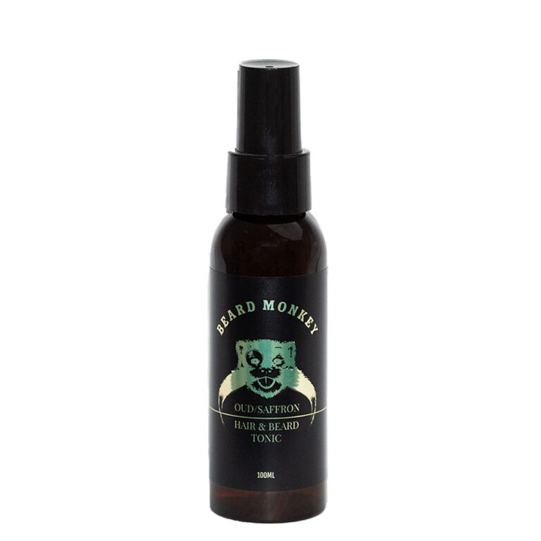 Beard Monkey Hair & Beard Tonic Oud/Saffron – svart sprayflaska med guldiga detaljer och en gyllene apa på etiketten.