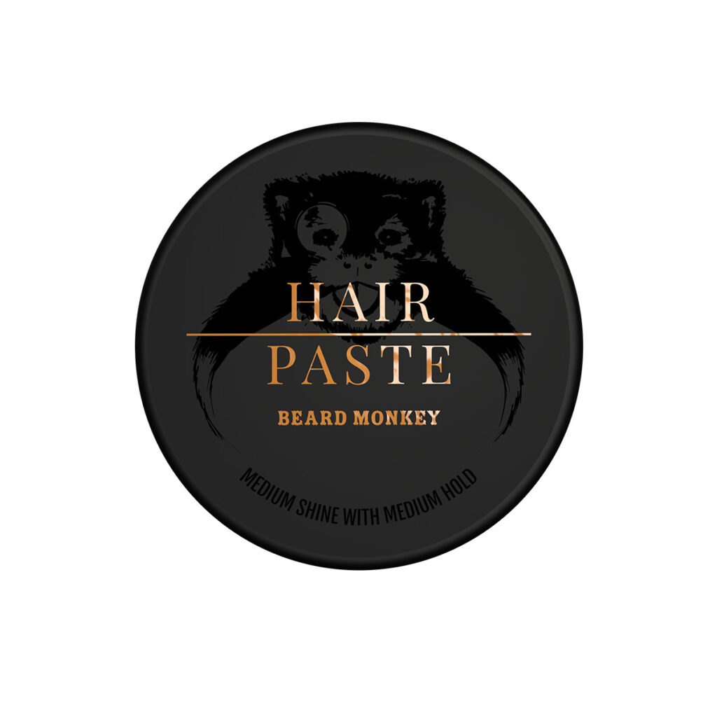 Svart Beard Monkey Hair Paste burk med glansig svart logga och detaljer i orange färg. Hårvax med medium stadga och matt till något glansig finish för alla hårlängder.