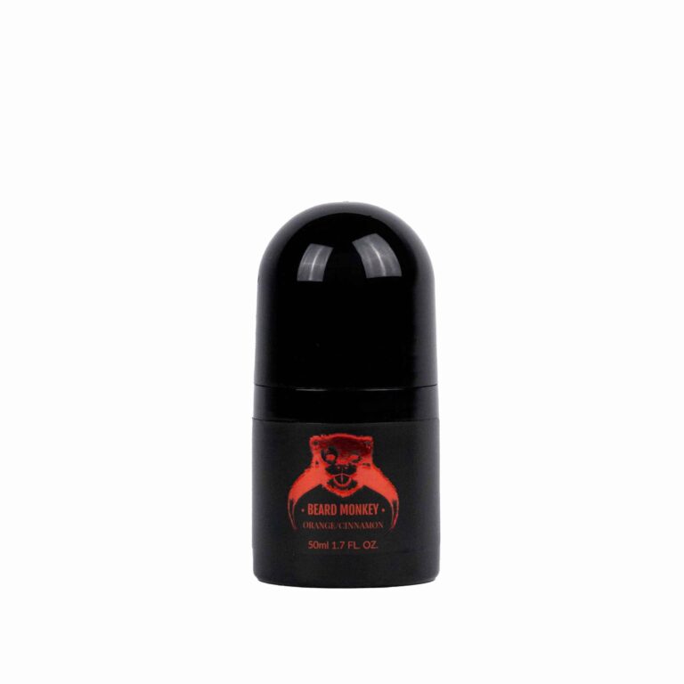 En svart cylindrisk deodorant med röda detaljer märkt "Beard Monkey Orange/Cinnamon" med en apa som logotyp.