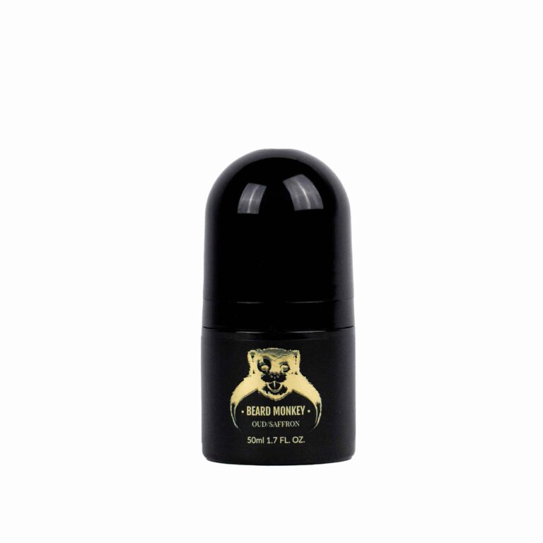 En svart cylindrisk deodorant med guldiga detaljer märkt "Beard Monkey Oud/Saffron" med en apa som logotyp.