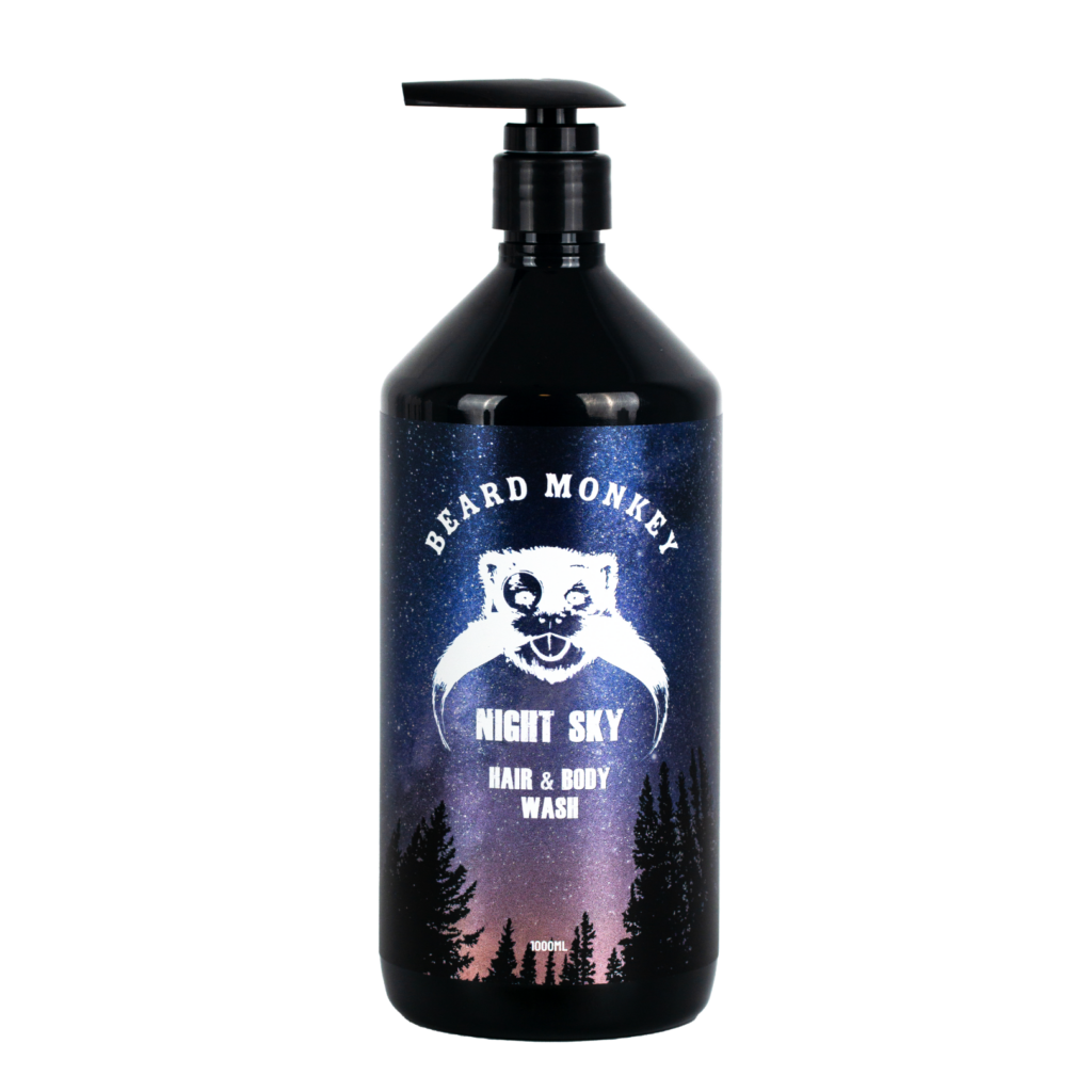 Svart pumpflaska Beard Monkey Hair & Body Wash Night Sky 1000 ml. Etiketten har en bakgrund med rosa och blå stjärnhimmel och vita detaljer.